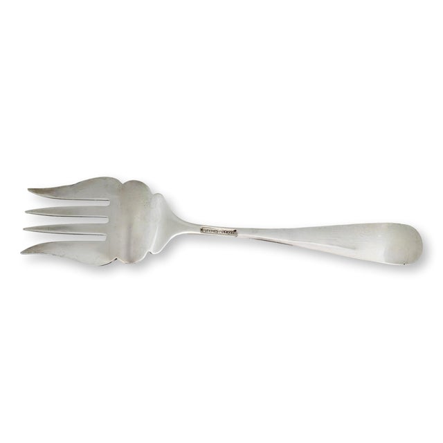 An elegant Kirk Stieff Rose Pattern sterling silver cold meat serving fork, beautifully decorated with the celebrated high...