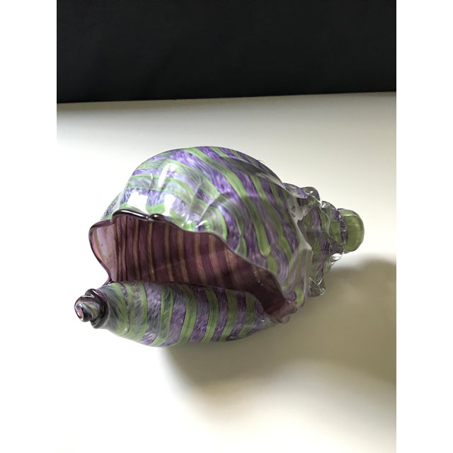 This beautiful large Purple and Green Conch Shell with its symetrical ribbing and perfectly detailed is stunning. Signed...