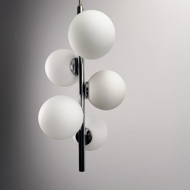 Chrome-Plated Elongated Pendant Light with Five White Opal Glass Spheres, Germany, 1970s, in Very Good conditions....
