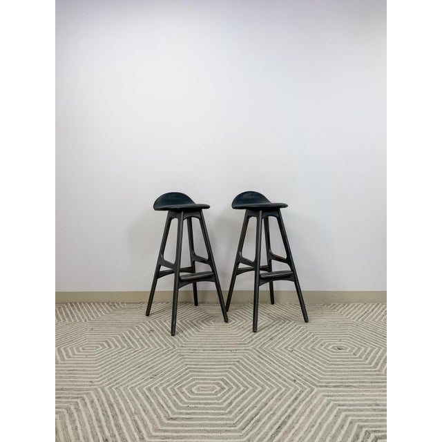 This pair of vintage Erik Buch mid-century modern teak barstools are a serious and highly collectible Danish modern find....