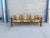 This striking 1970s mid-century modern safari-style sofa combines bold architectural structure with quintessential vintage...