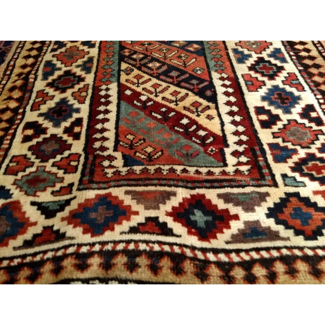 Beautiful and colorful vintage Caucasian Gendje Kazak runner from the late 1800s. The Gendje runner is in an allover...