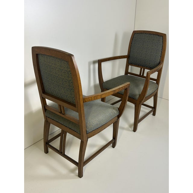 The armchairs have the original period fabric.