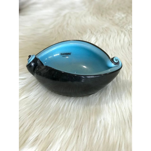 Medium-sized, black and aqua Murano glass shell dish from the now-closed Barbini Factory, circa 1955. With flecks of 24K...