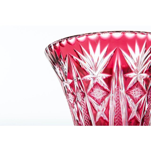 Vintage crystal cut cranberry vase. The vase stand 10 inches high x 6.5 inches top diameter.
