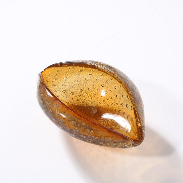 This Mid-Century Modernist hand-blown Bullicante Murano glass dish, crafted in Italy circa 1960, is a dazzling example of...