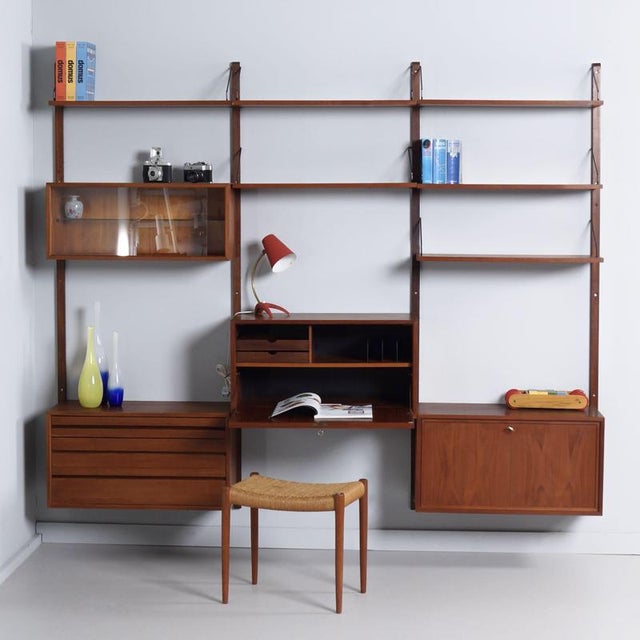 Royal system by poul cadovius from the 1960s, a 14-piece modular teak wall system for cado. The set combines open shelves...