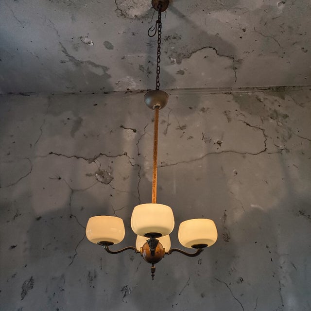 Designed by Paavo Tynell, the 1373 pendant lamp from the 1930s embodies the designer's timeless design language and use of...