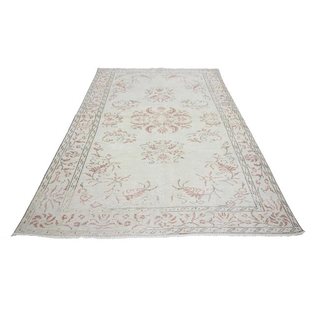 Washed Out vintage handknotted rug from Oushak region of Turkey. Approximately 50-60 years old. In very good condition