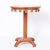 Pair of stylized neoclassic mid-century stands or tables crafted in hardwoods with a mahogany finish having round grain...