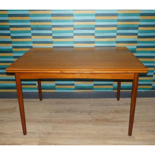 Beautiful, sturdy, large dining table Elegant classic, made in Denmark (brand mark) Teak real wood veneer with rounded...