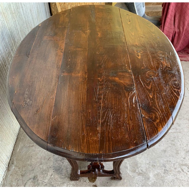 18th century carved oak gateleg from Spain. The top has a rounded edge and the Lyre legs are wonderfully hand-carved all-...