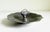 A pewter ashtray catchall dish that blends rustic and Art Deco modernism. Featuring a stylized fish rising from the center...