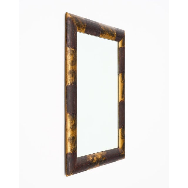 Mirror, polychrome and patinated.