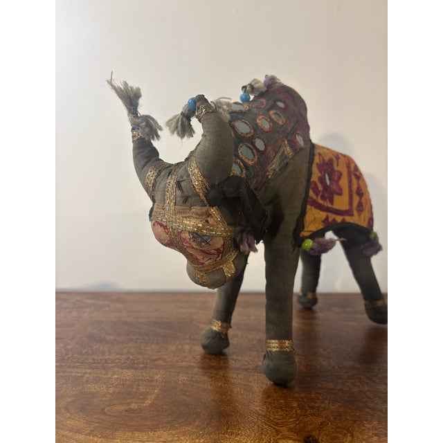 A charming vintage handcrafted Rajasthani fabric bull from India, richly decorated with traditional patchwork textiles,...