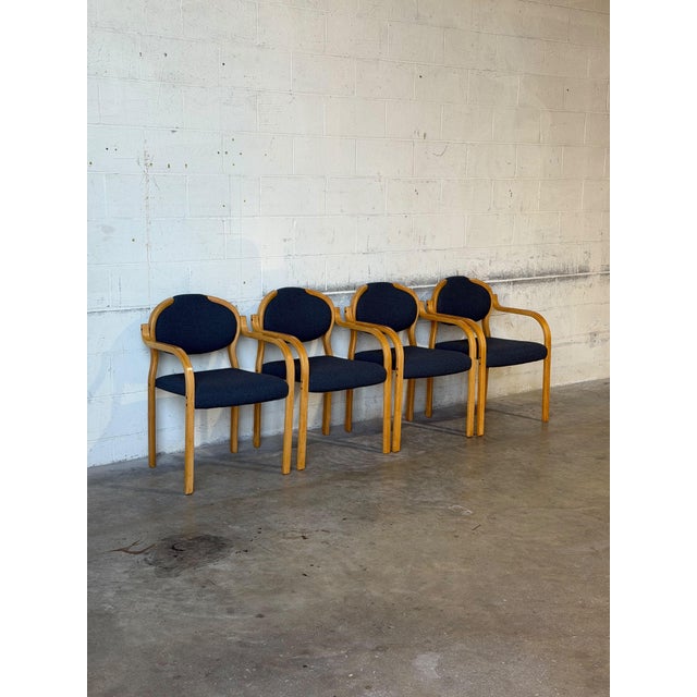 Beautiful set of four vintage Danish armchairs crafted from warm, natural beechwood and featuring newly upholstered seats...