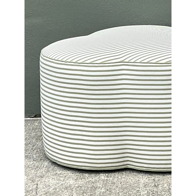 This charming cloverleaf ottoman is a masterclass in playful Hollywood Regency design, offering a unique trefoil...