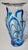 This vibrantly blue accented base was hand blown , then strips of blue glass were applied while it was still hot. The...