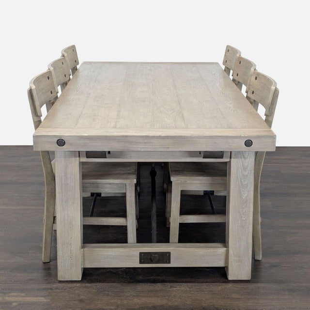 This Pottery Barn dining set features a sturdy rectangular wood table with a light, natural finish and industrial metal...