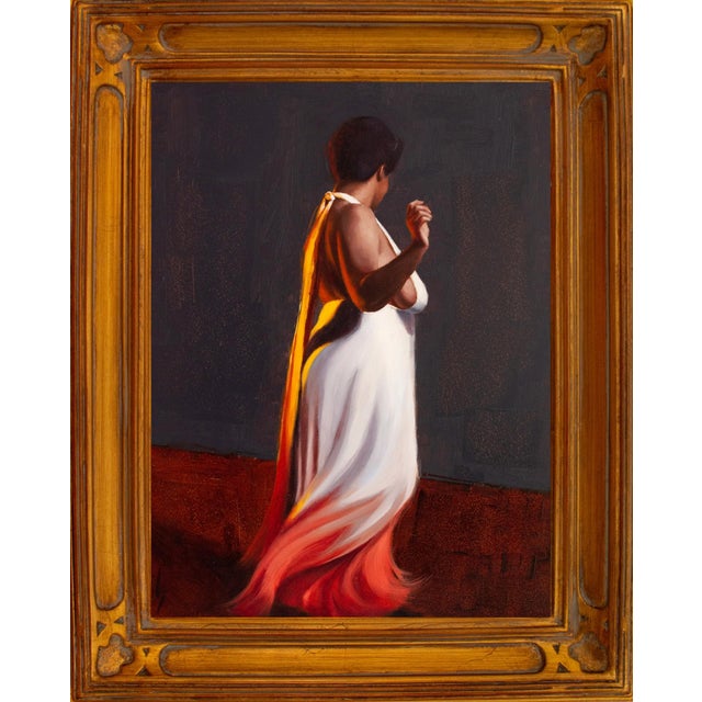 In "Liquid Sunset I," a figure draped in a flowing white garment stands against a muted backdrop, with warm hues of orange...