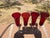 This is a lovely set of 4 ruby red ribbed champagne flutes. they have a ruby red ribbed bowl with a clear base and long...