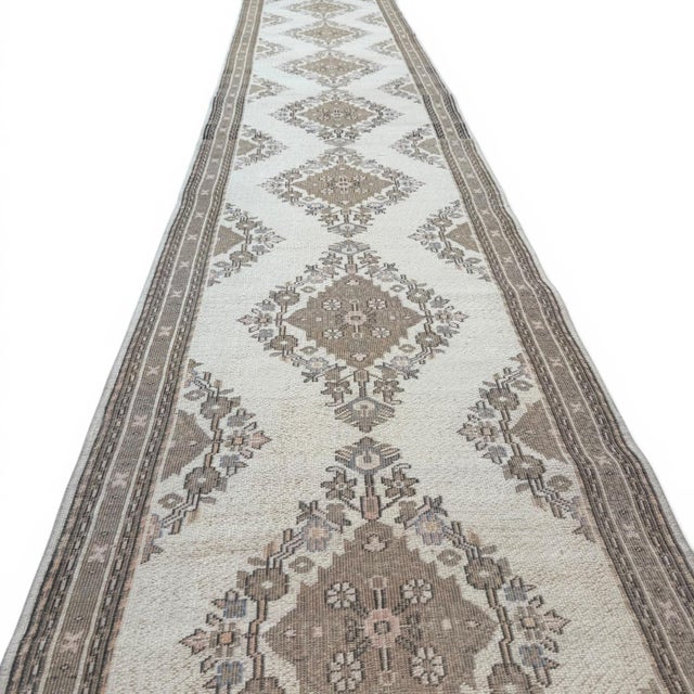 This exceptional vintage Hereke runner, approximately 80 years old, embodies the refined craftsmanship and understated...