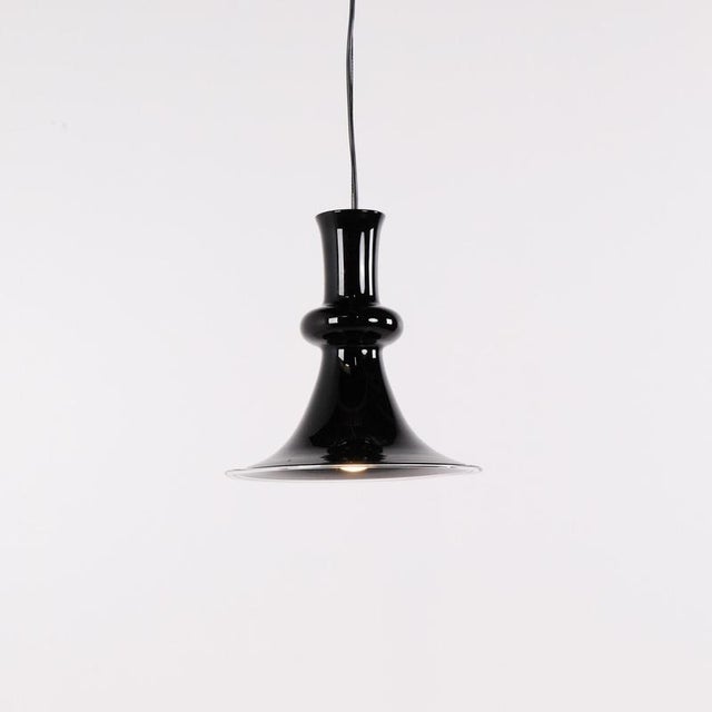 Etude pendant designed by michael bang for holmegaard in the 1970s. The lamp is made in black glass and has a simple,...