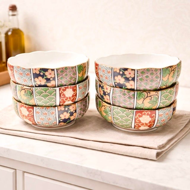 A set of six vintage Arita Fine China porcelain bowls decorated in a richly patterned Imari palette of cobalt blue, iron...