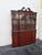 This brilliant Breakfront China Cabinet is made of wood, solid wood, mahogany wood, flame mahogany veneer, and glass. This...