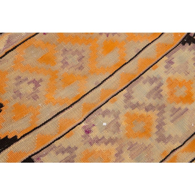Beautiful Vintage Kilim hand-knotted wool runner with multicolor accents in an all-over geometric design. This rug...