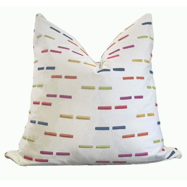 Contemporary embroidered "dashes" bring white canvas to life in brilliant tones of red, blue, magenta, orange, gold and...