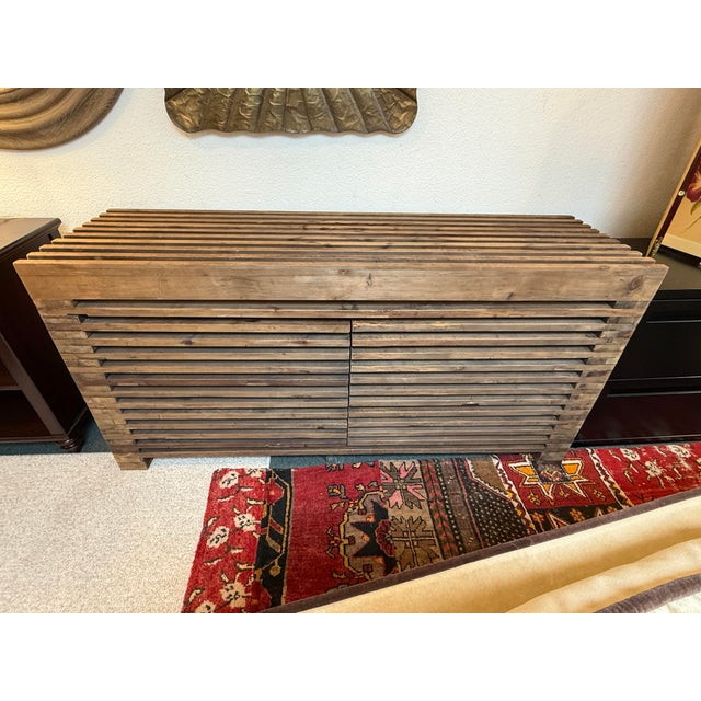 Design Plus Gallery presents a Slatted Sideboard from Restoration Hardware. The striking slatted design is smooth to the...
