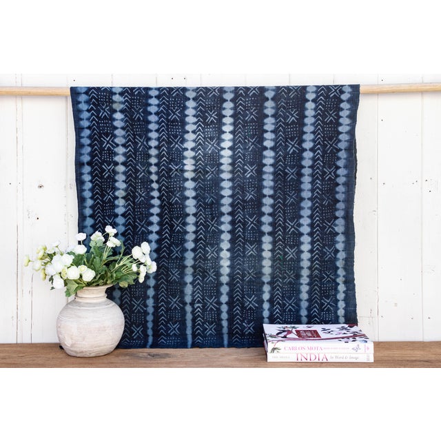 These lovely Malian mud cloths are hand-woven fabrics dyed with plant based indigo fermented mud and washed to reveal...