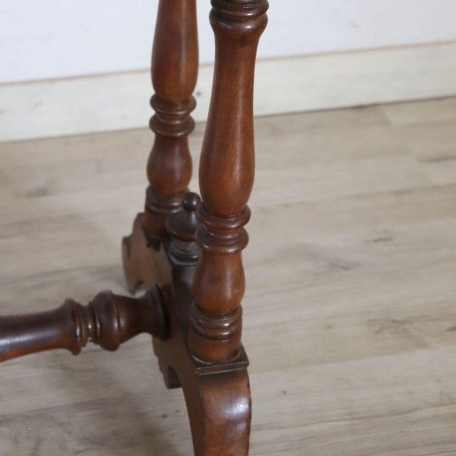 We present this refined antique Italian side table dating back to the mid-19th century. It features the stylistic and...