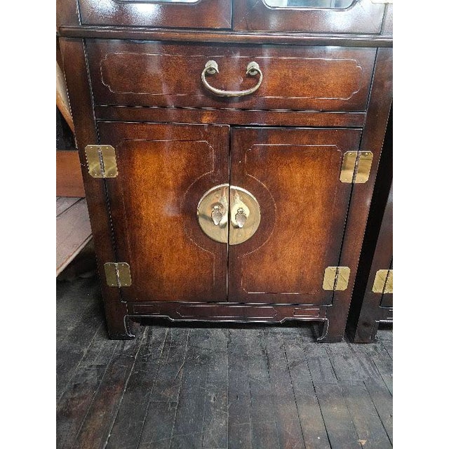 Vintage Chinoiserie-style curio display cabinet crafted by American of Martinsville. Dating to the late 20th century, this...