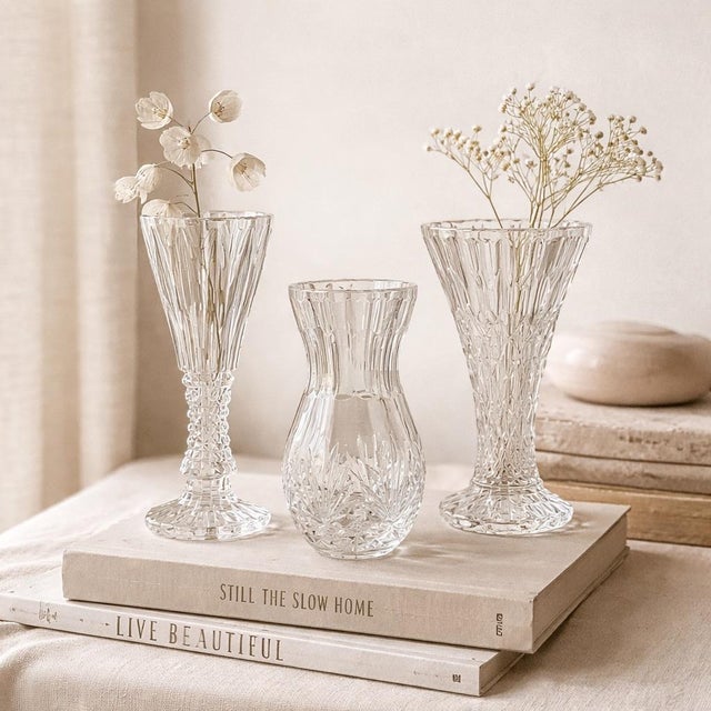 A beautifully curated trio of vintage crystal and cut glass bud vases, selected for their complementary forms, varied...