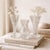 A beautifully curated trio of vintage crystal and cut glass bud vases, selected for their complementary forms, varied...