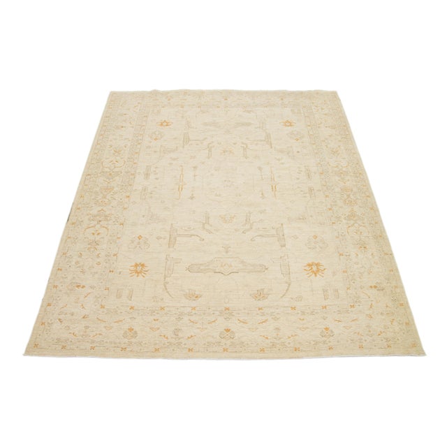 Beautiful Paki Peshawar hand-knotted wool rug with a beige field. This modern rug has tan and brown accents in a gorgeous...