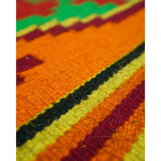 Handwoven wool flatweave area rug (loom-woven), featuring a bold Southwestern / Mexican serape-style geometric design with...