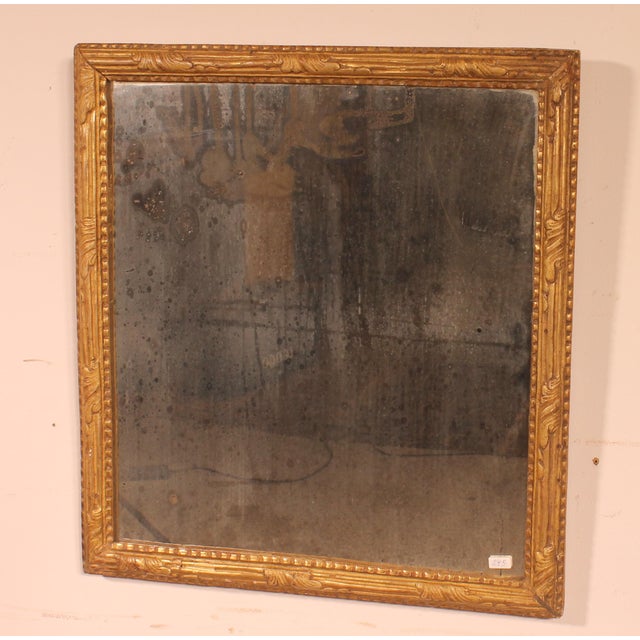 Rectangular mirror in carved and gilded wood Louis XVI XVIII period. Frame formed by finely carved moldings with a frieze...