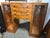 An exceptional and highly unique 1930s Art Deco burlwood veneer silver storage canteen. It features a central stack of...