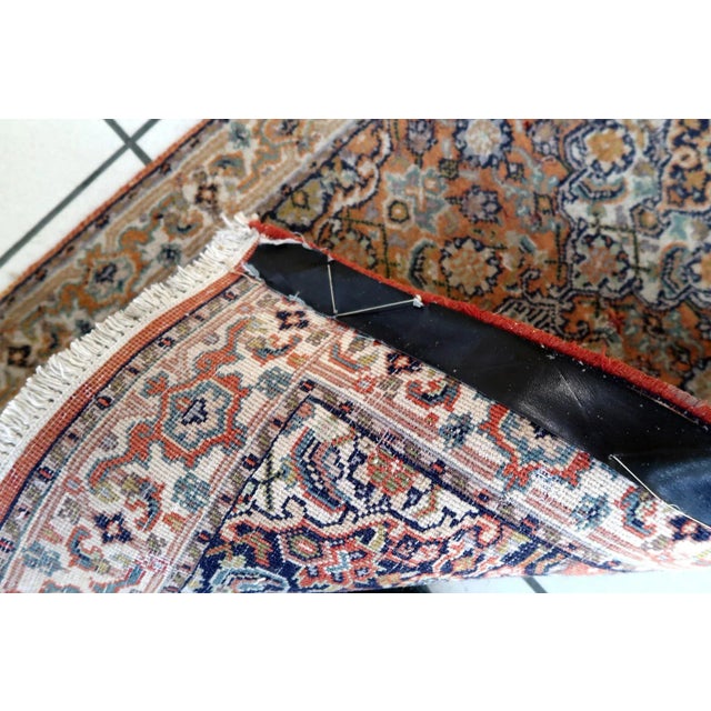 Handmade vintage Indian Tabriz runner in original condition, it has some signs of age. The rug has been made in in the end...