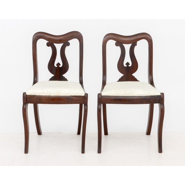 American Classical Mahogany Side Chairs, 19th century, the seats with white boucle upholstery. 32.5" H x 18" W x 20" D;...