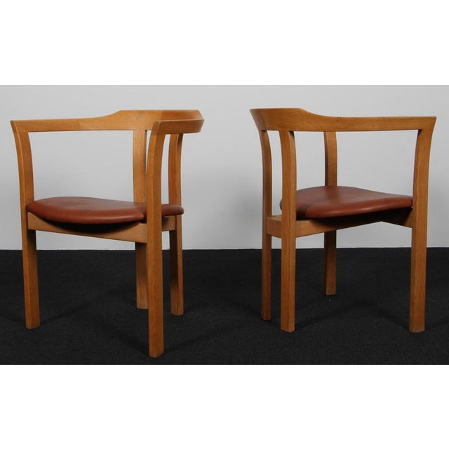 Hans Olsen armchair with frame of solid oak. Seat new upholstered with cognac aniline leather. Made by C. S. Møbler. This...