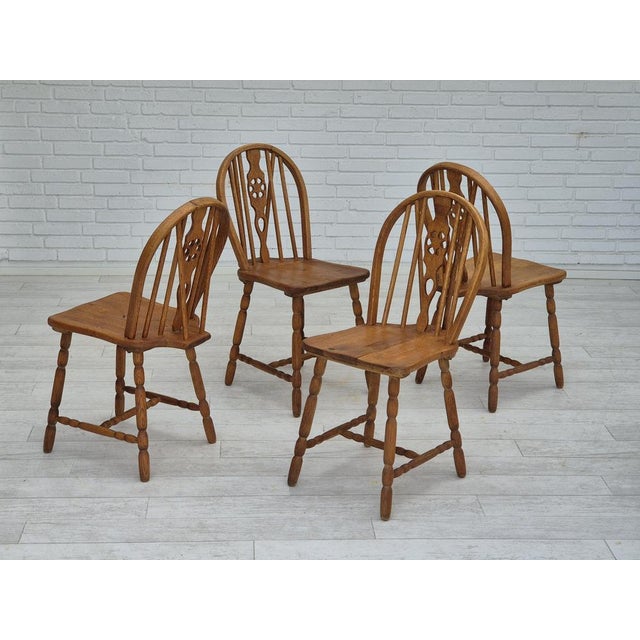 1960s, set of 4 dining chairs in solid oak wood. Original good condition: no stains and no smells. Manufactured by Danish...
