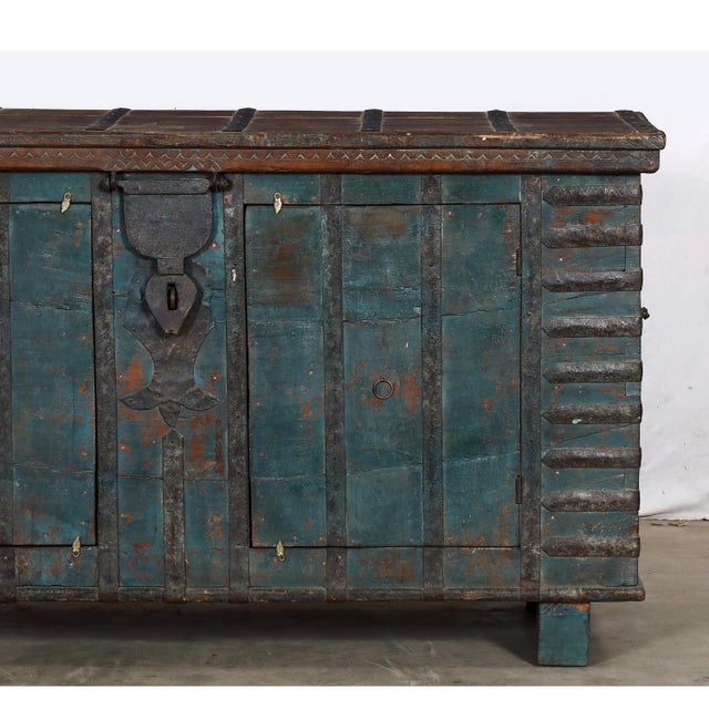 Once a traditional storage chest in Rajasthan, this antique teakwood pitara has been reworked into a beautifully...