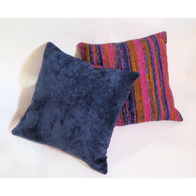 A pair of striking multi-color hand-woven throw pillows. The pillows are hand sewn with precise strong stitching. I found...
