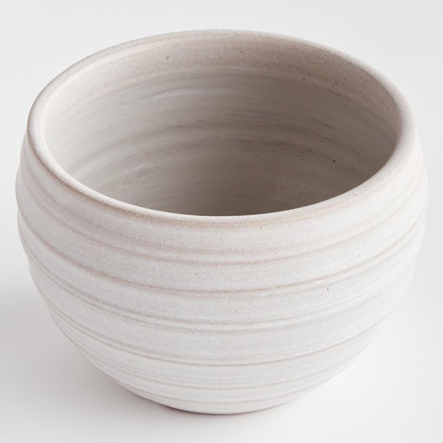This handthrown pot has a weighty feel. Made with subtle ridges and a matte finish. The perfect little pot for your...