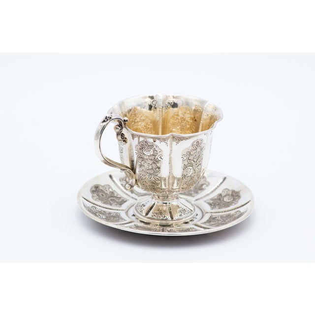 Silver Cup and Saucer with Floral Motifs, Set of 2, in Very Good conditions. Designed before 1890 This piece has an...