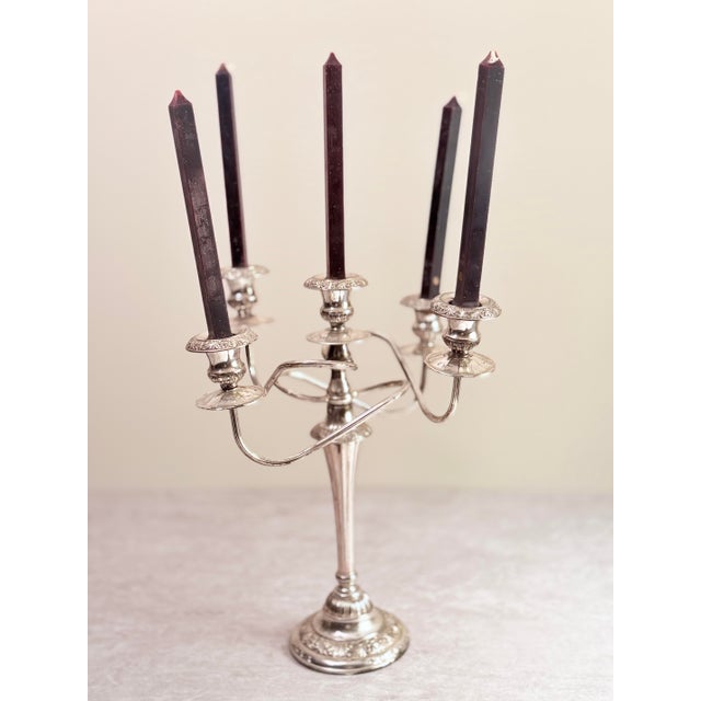 A commanding example of Art Nouveau decorative metalwork, this antique Italian silver-plated five-arm candelabra channels...